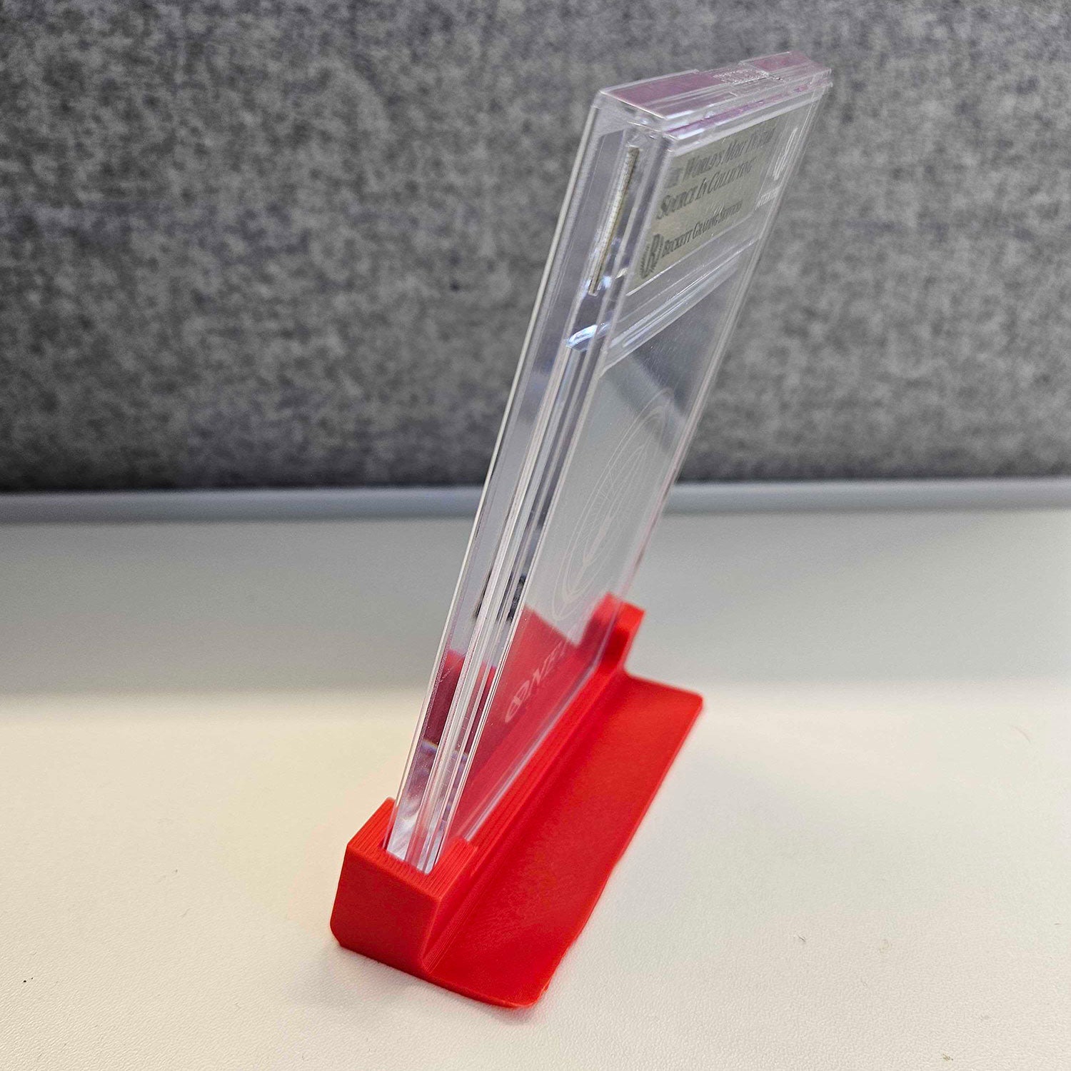 CGC-graded comic book displayed next to raw, ungraded comics