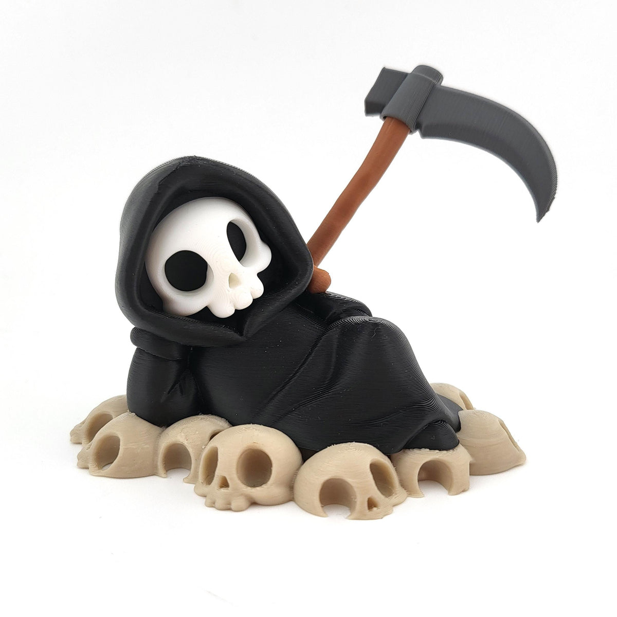 The Lazy Reaper lounging on a pile of skulls, his scythe propped behind him