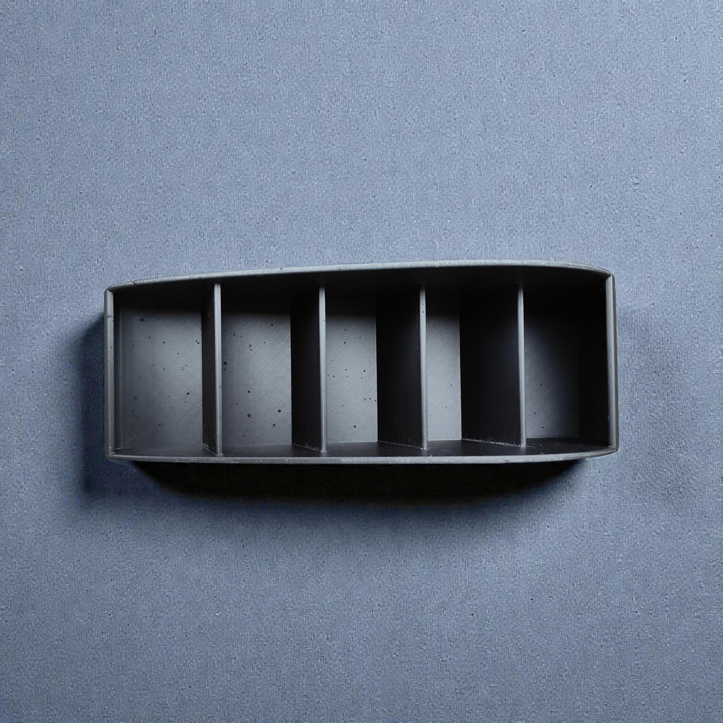 Remote caddy from above, showing the slots