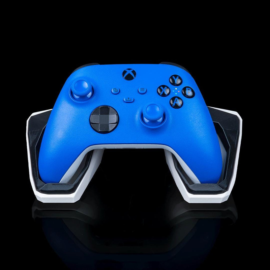 Geometric controller stand from the front, holding a blue Xbox controller