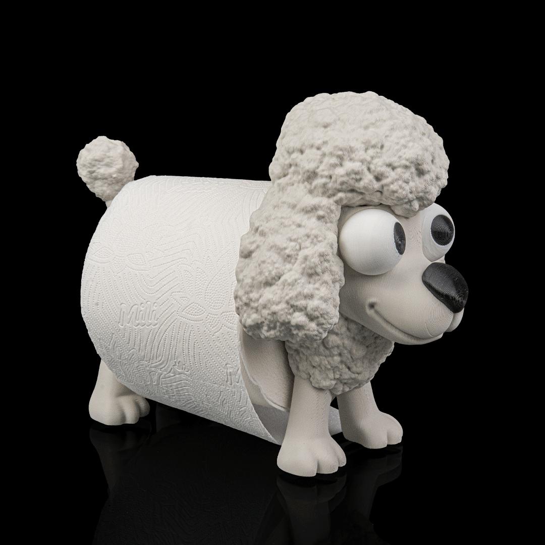 Poopoodle with a toilet roll, from an angle, showing its googly eyes