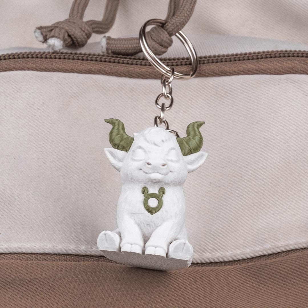 Taurus chibi bull keyring hanging from a bag