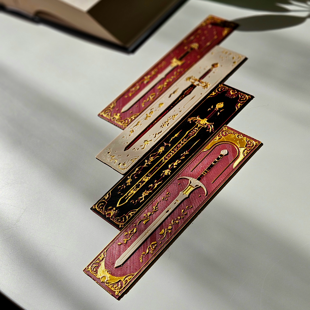 Decorative incense sticks with gold accents on a white surface