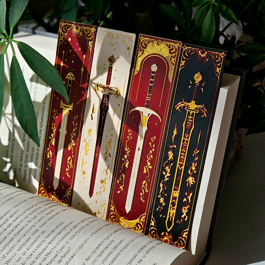 Four decorative sword bookmarks on an open book with a plant in the background