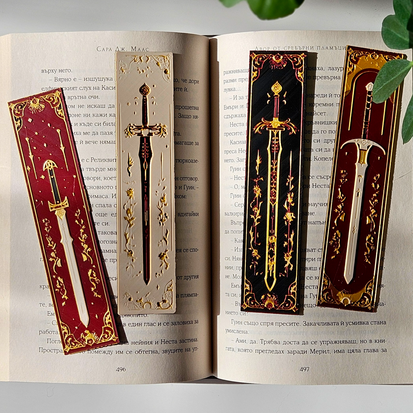 Decorative sword bookmarks on an open book