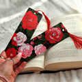 Floral bookmark with tassel on an open book