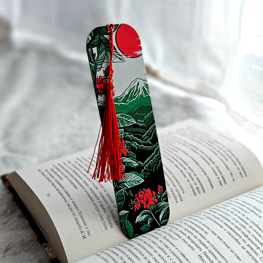 Decorative bookmark with tassel on an open book against a soft white background