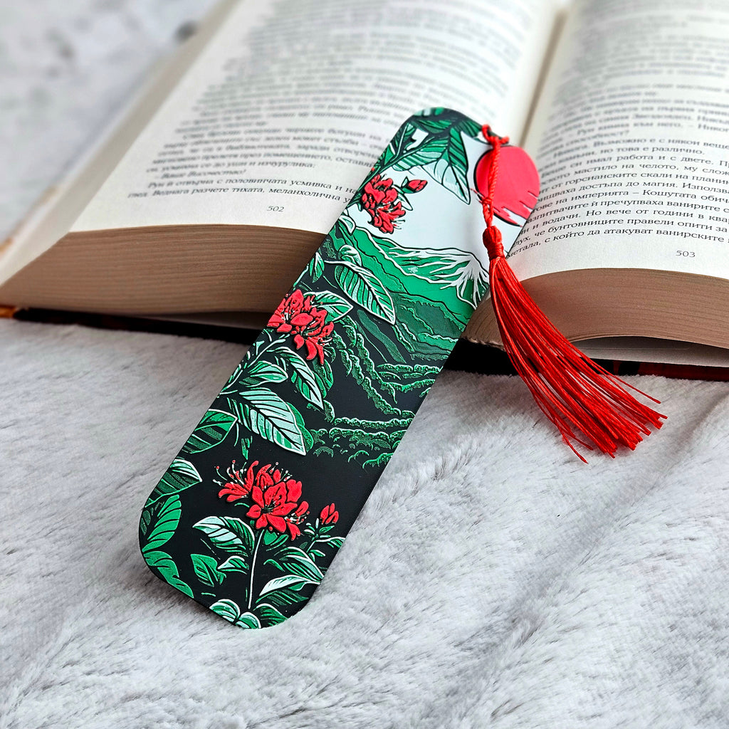 Floral bookmark with a red tassel on an open book
