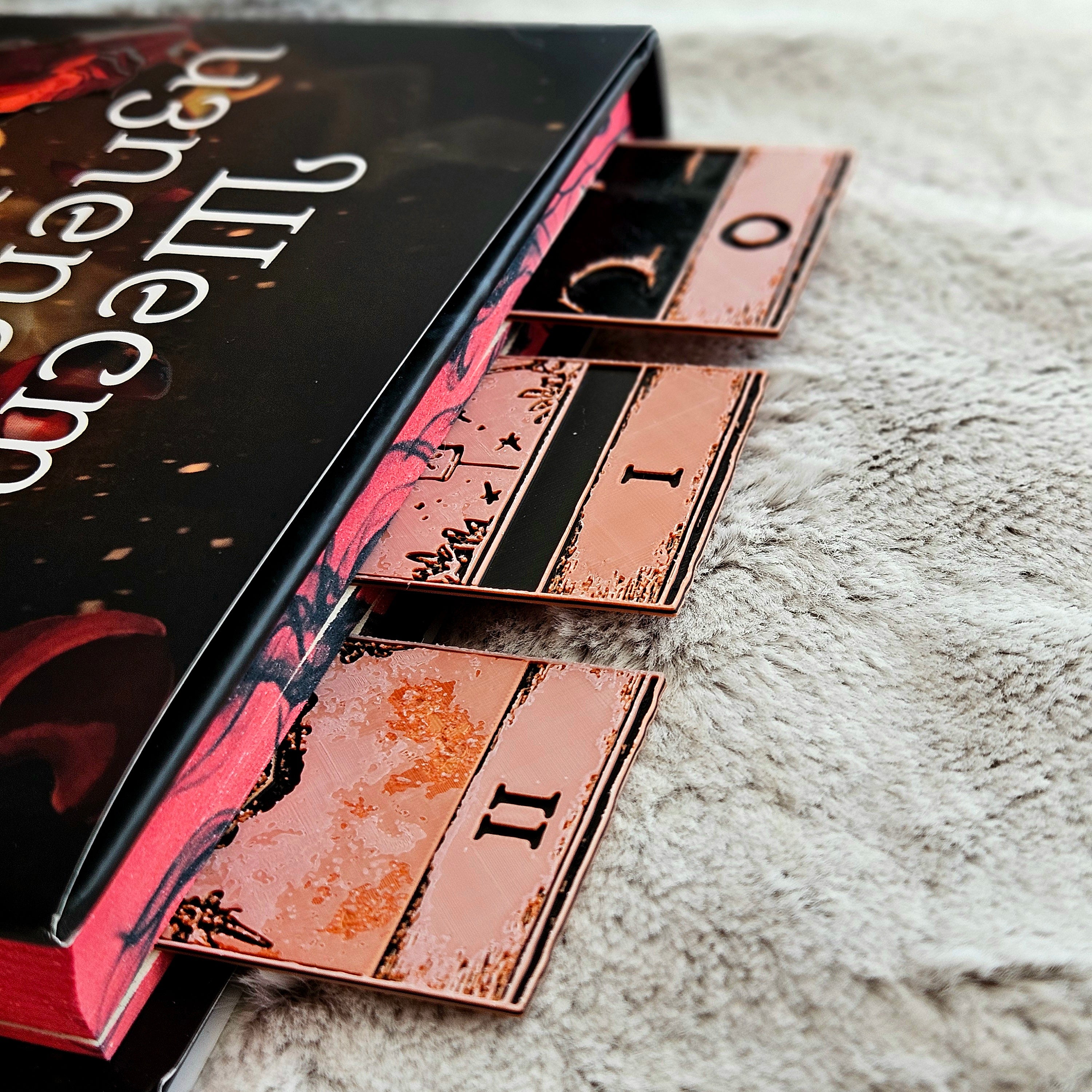 Set of tarot cards with a dark cover on a textured surface