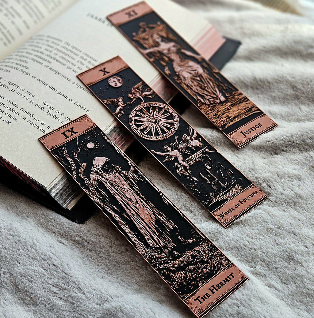 Set of tarot card bookmarks on an open book