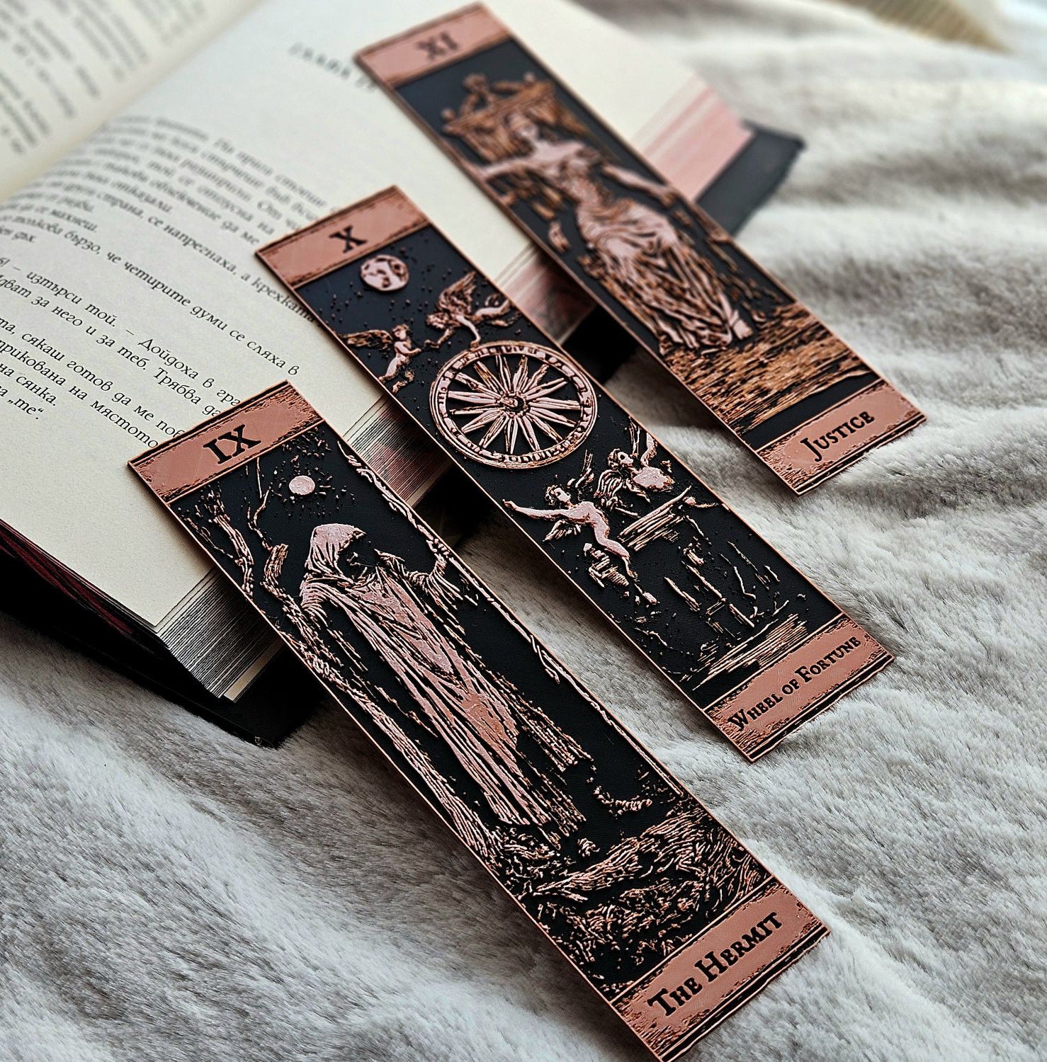 Set of tarot card bookmarks on an open book