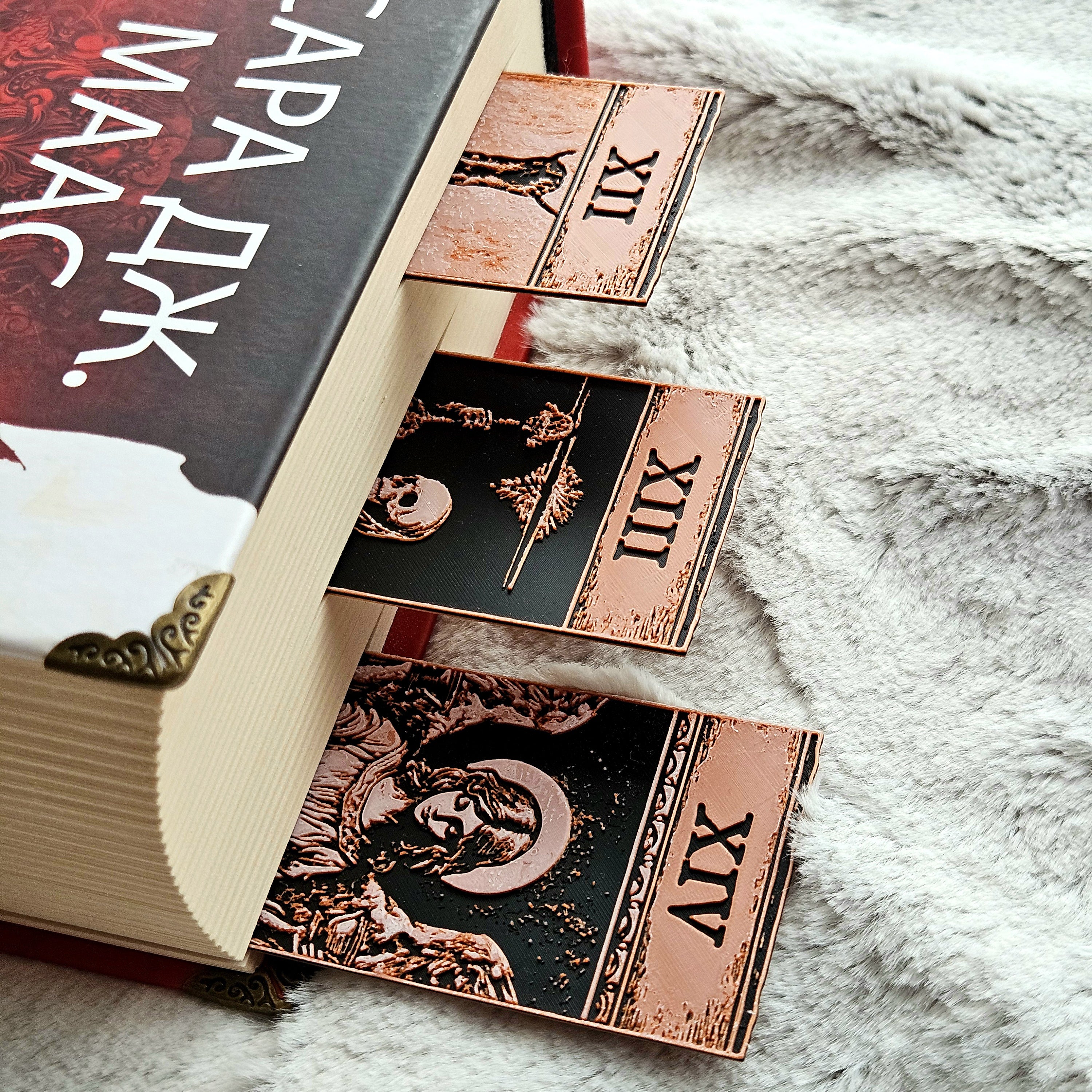 Tarot cards on a book with decorative cover