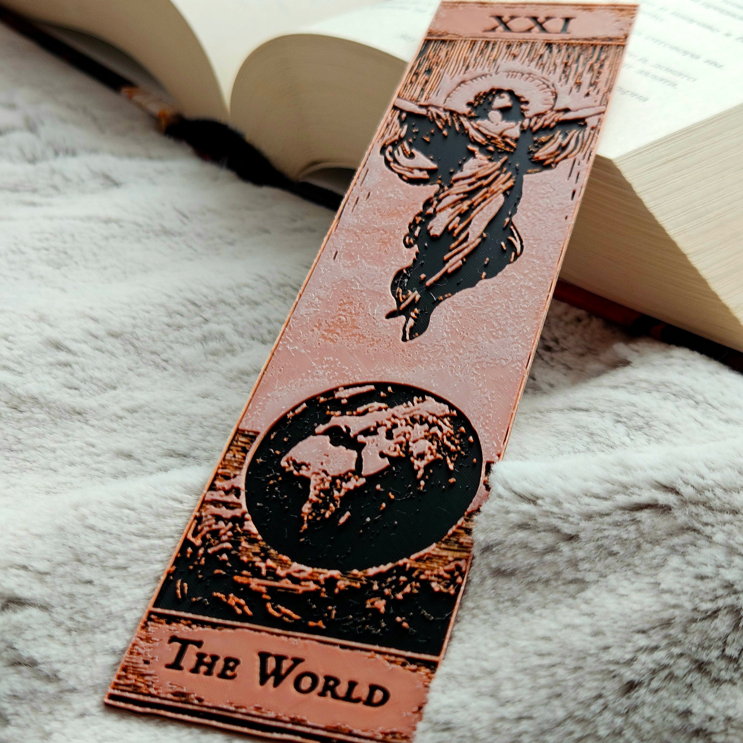 Decorative bookmark with tarot card design on a textured surface