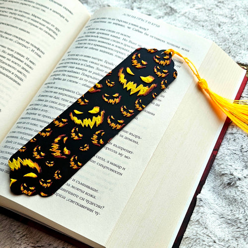 Bookmark with jack-o'-lantern design on an open book