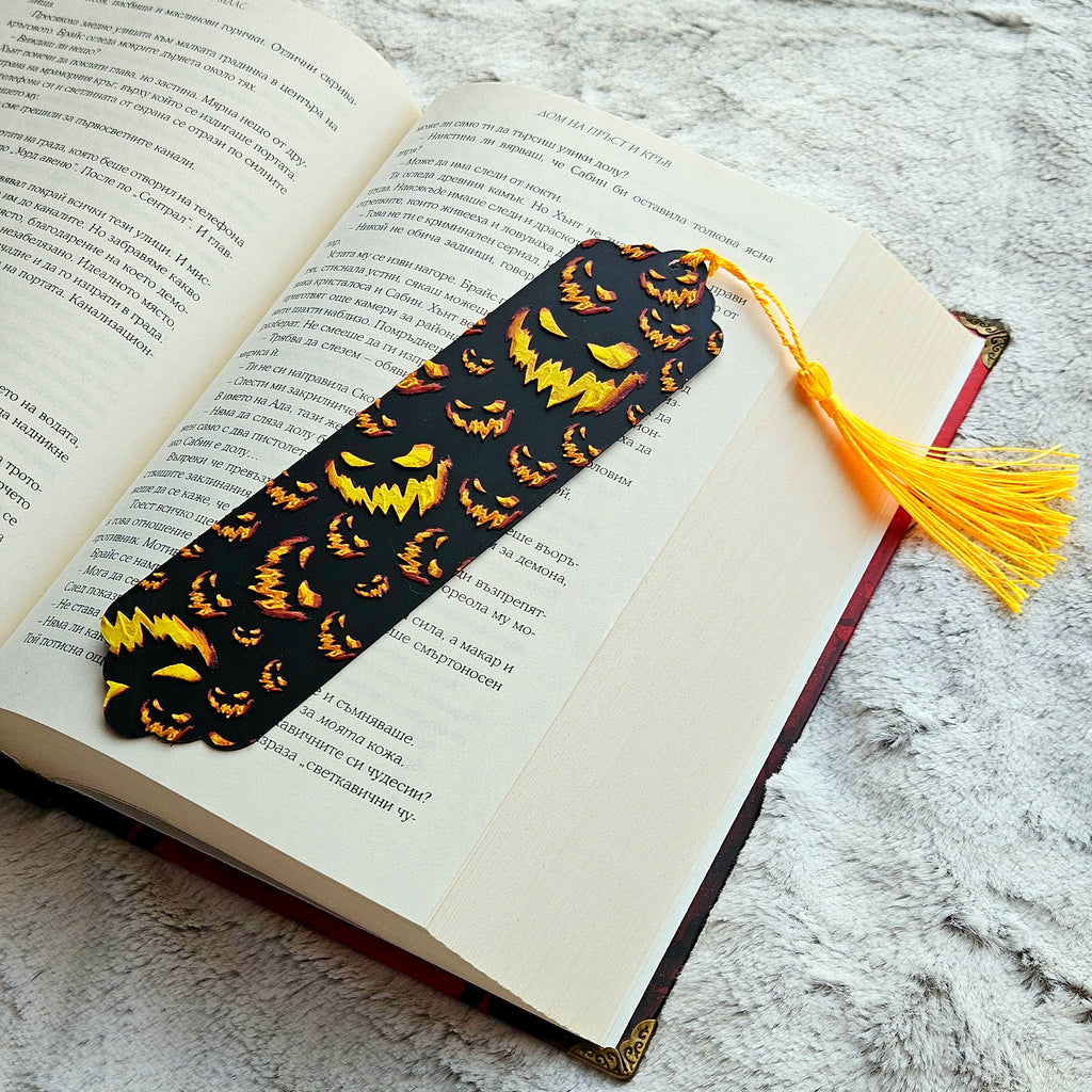 Bookmark with pumpkin pattern on an open book