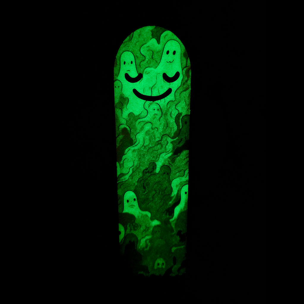 Glowing green bookmark with a smiley face design on a black background