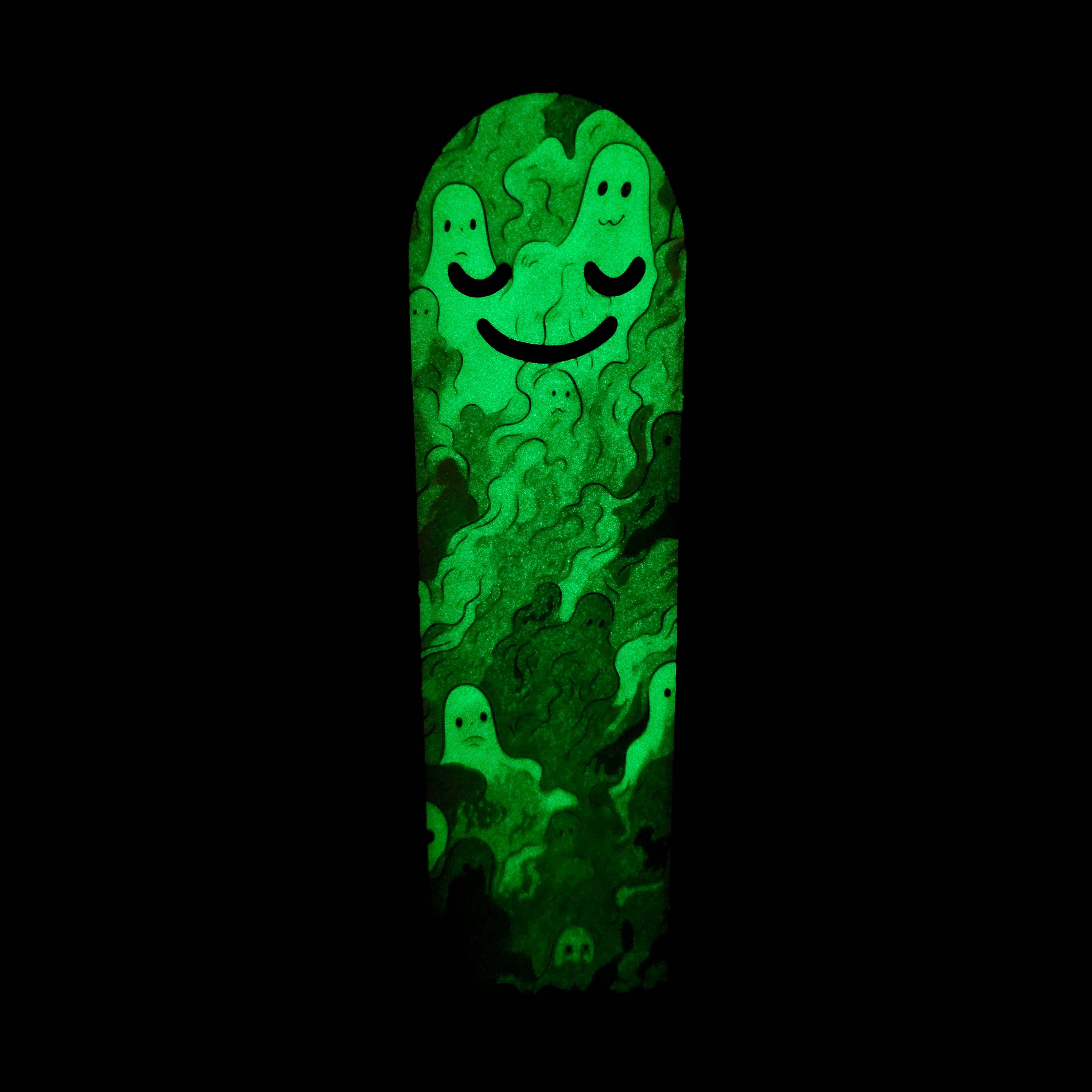 Glowing green bookmark with a smiley face design on a black background