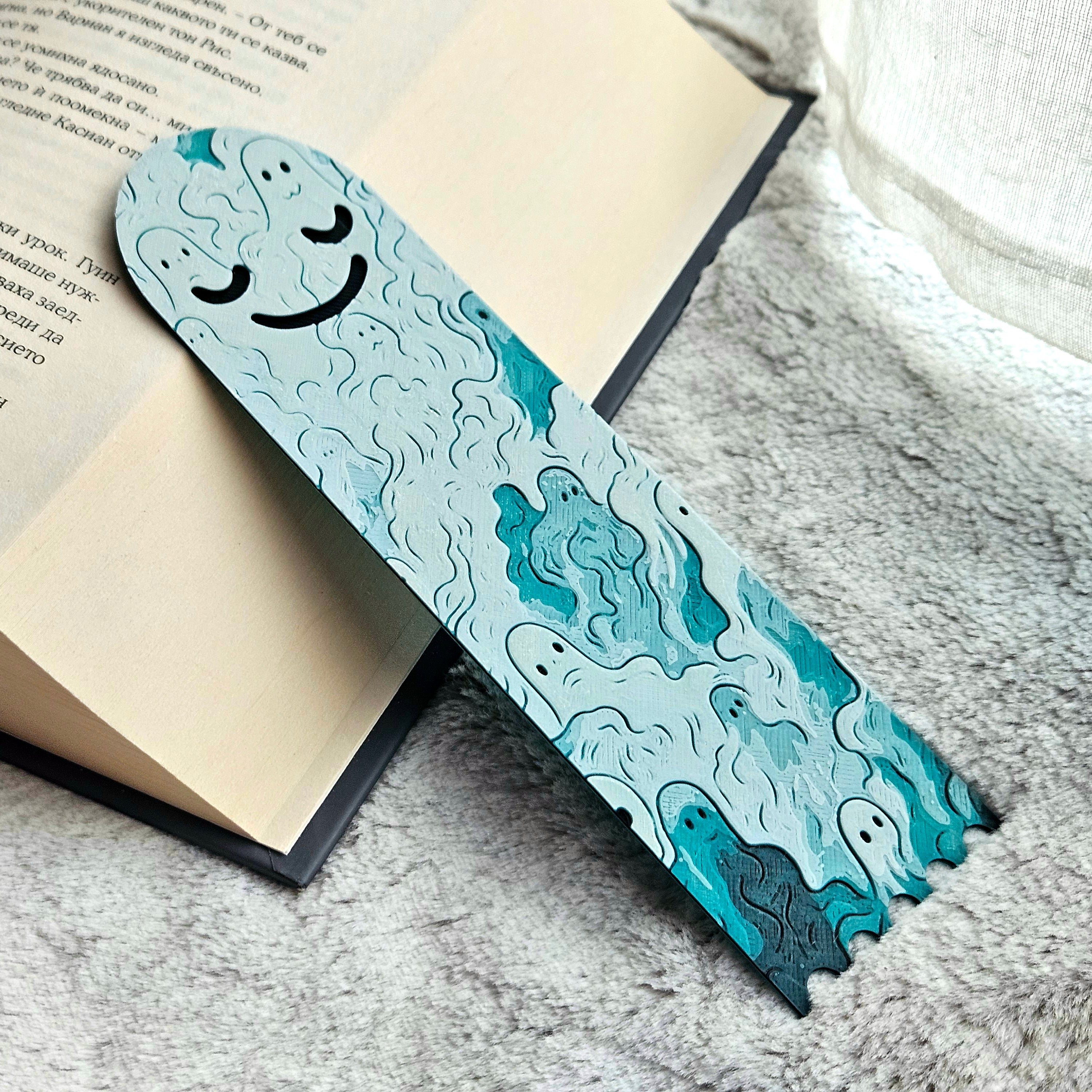 Bookmark with ghost design on a book