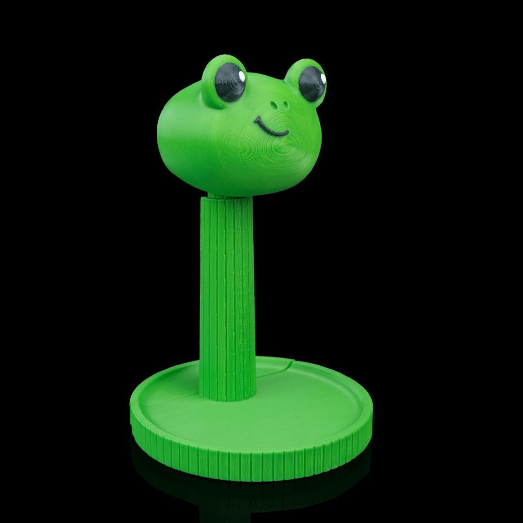Green frog headphone stand from an angle