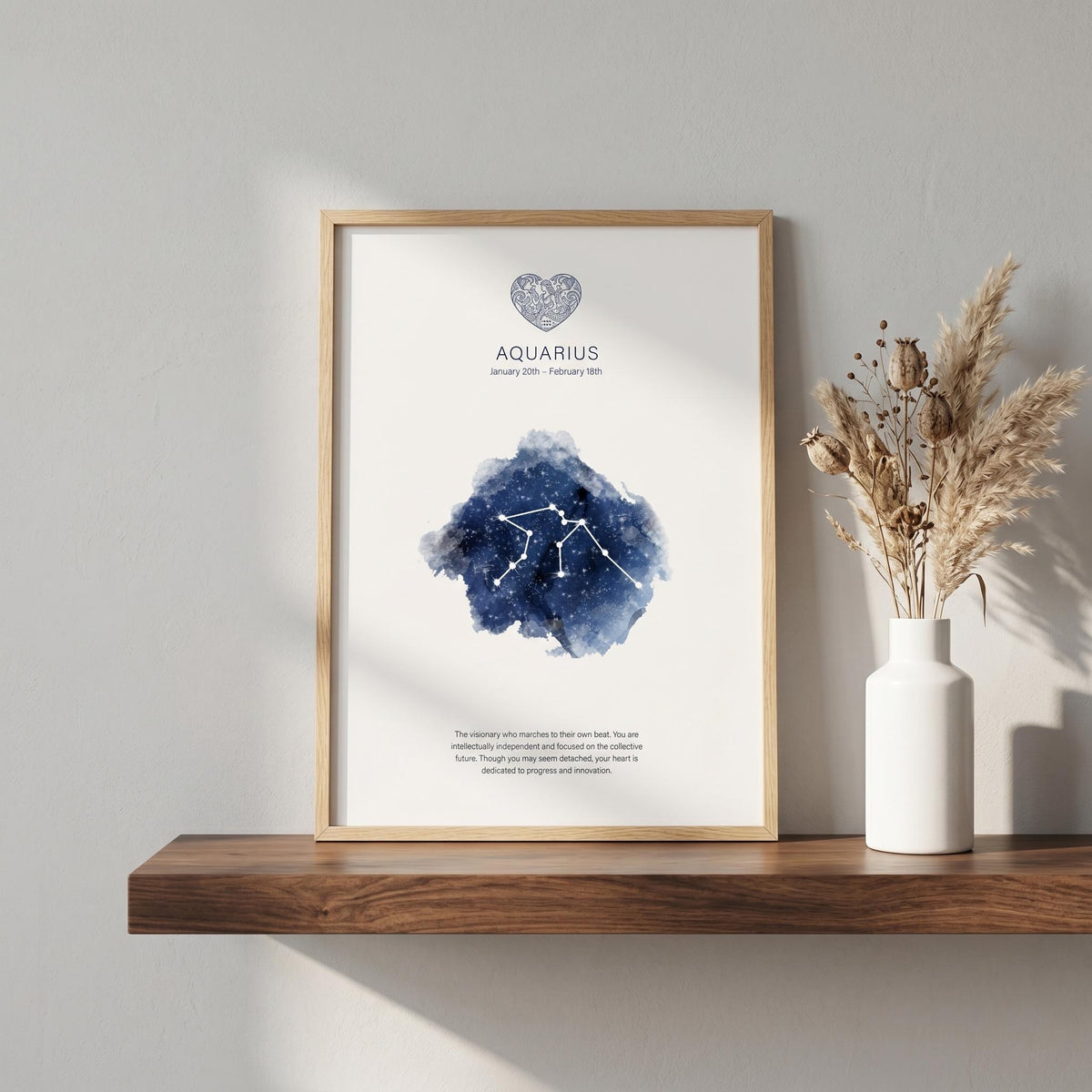 Aquarius zodiac constellation print in indigo watercolour, in a wood frame on a shelf