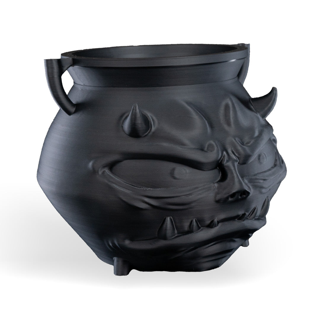 Black dragon head-shaped pot on a white background