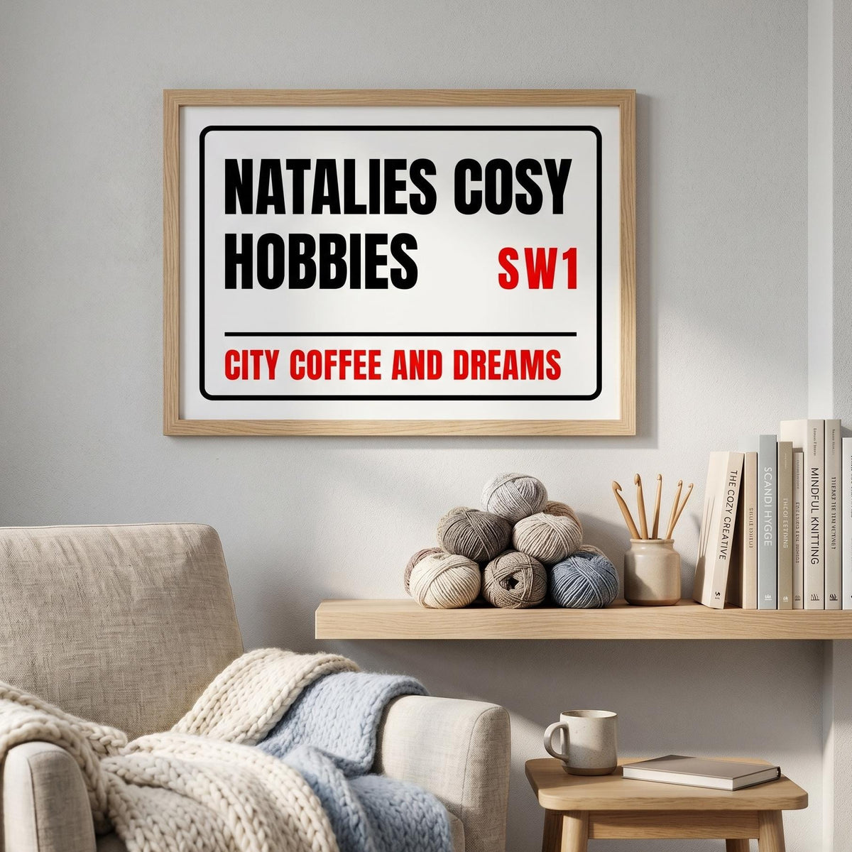 Street sign print reading Natalie's Cosy Hobbies, SW1, City Coffee and Dreams, above a reading chair