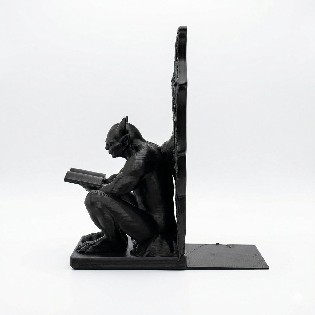 Gargoyle bookend from the side, showing the flat base that slides under the books