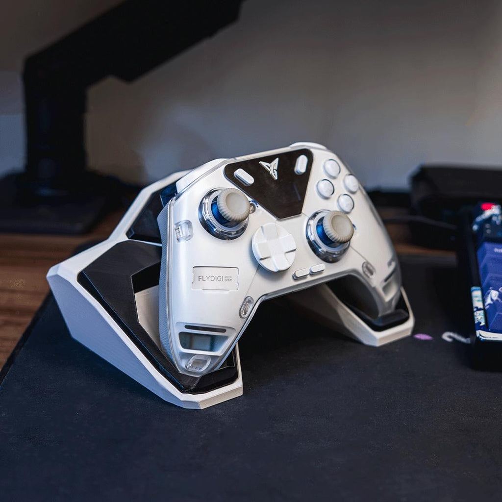Geometric controller stand with a white pro-style controller on a desk