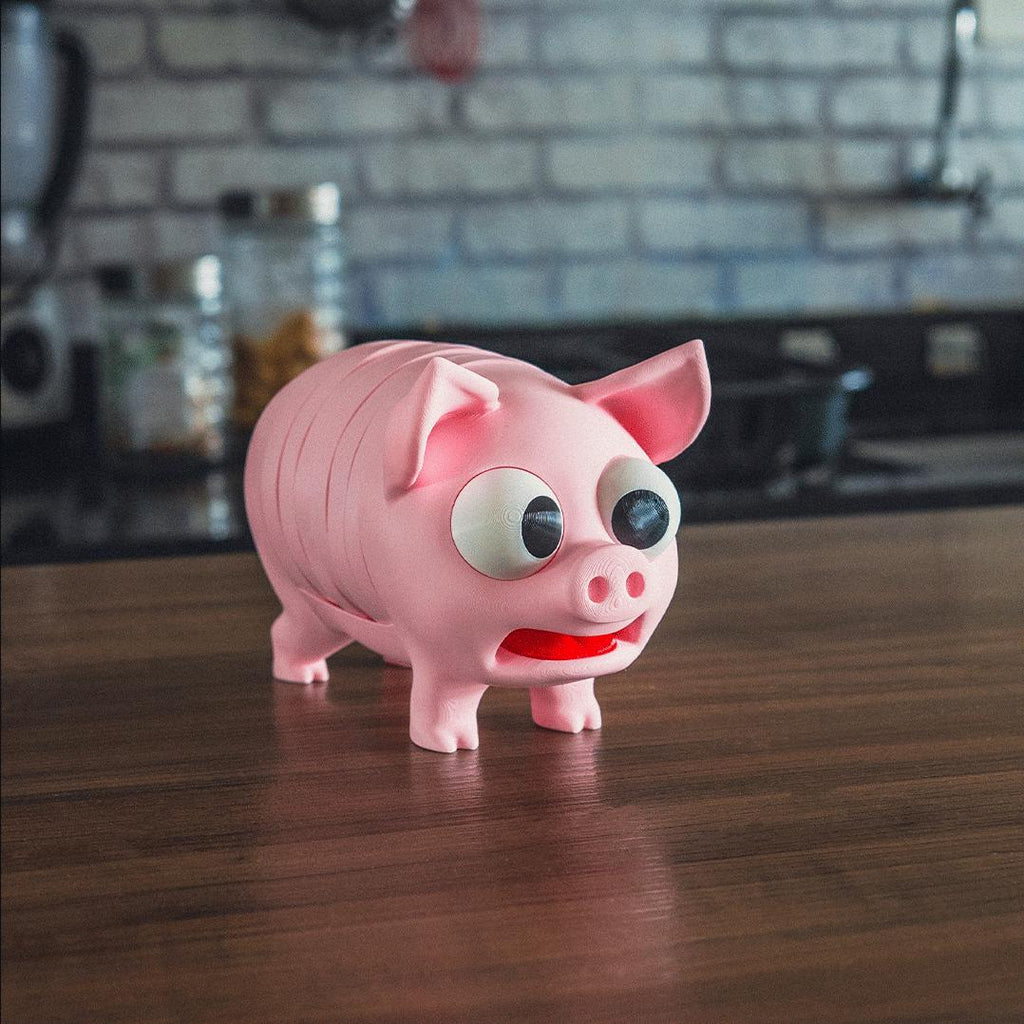 Pink Pork Chop pig coaster holder on a kitchen worktop