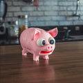Pink Pork Chop pig coaster holder on a kitchen worktop