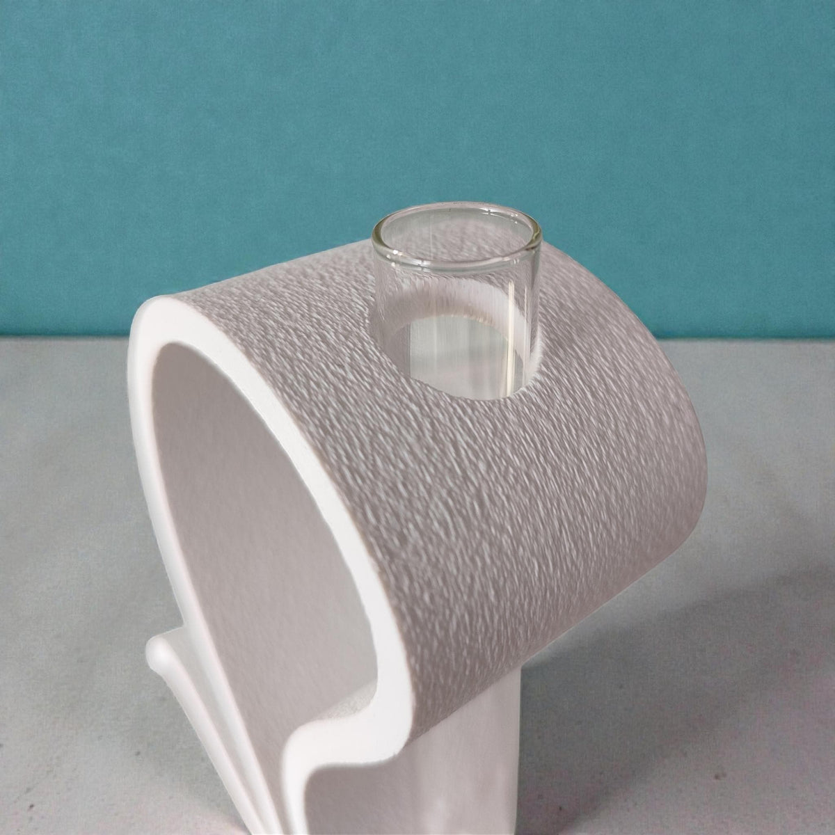 Close-up of the white stand's textured finish and the glass tube