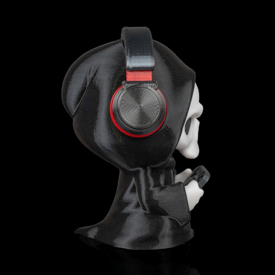 Gamer Grim Reaper figure from the side, showing the headphones
