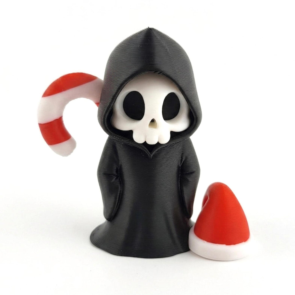 Santa Hat: a standing grim reaper with a candy cane behind it and a red Santa hat at its side