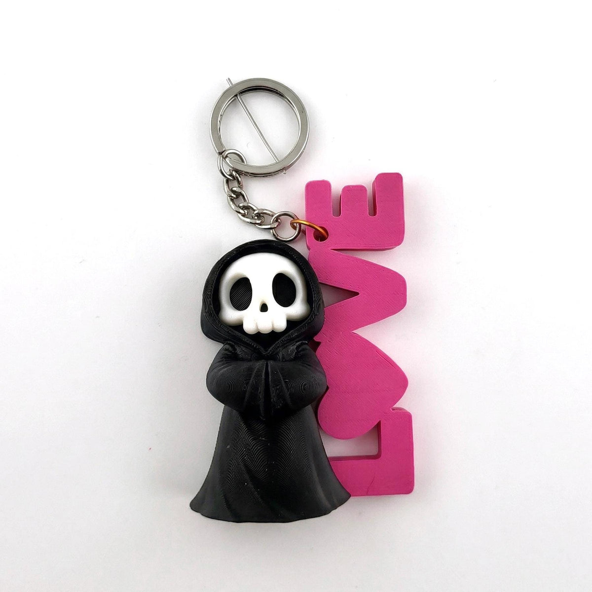 LOVE Sign keyring: a grim reaper standing beside a pink LOVE sign