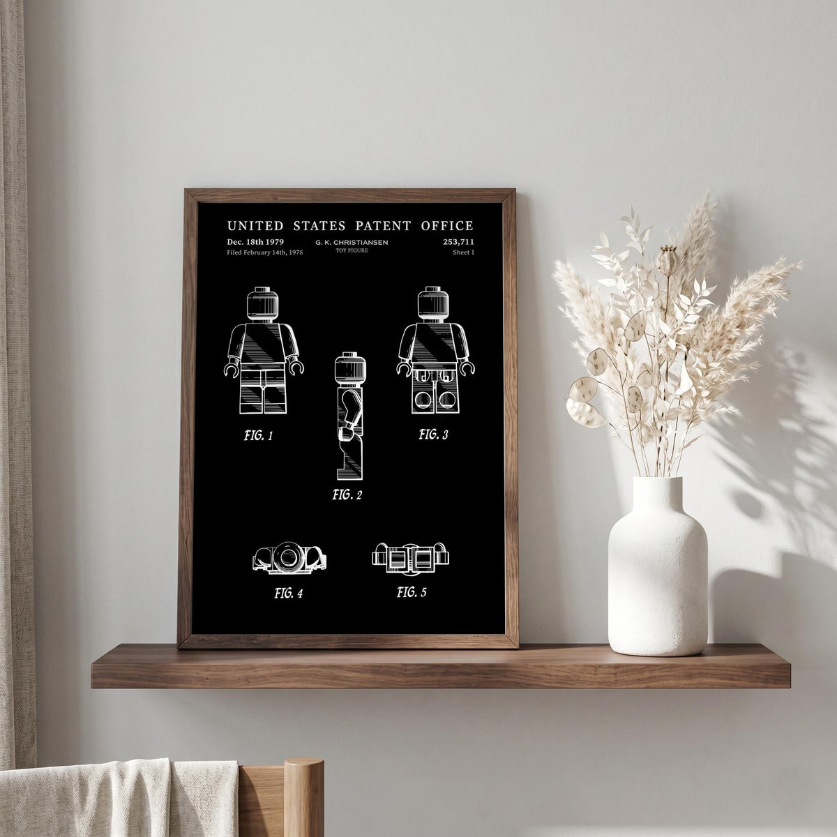 Toy figure patent print, sheet 1, in black with white lines, in a dark frame