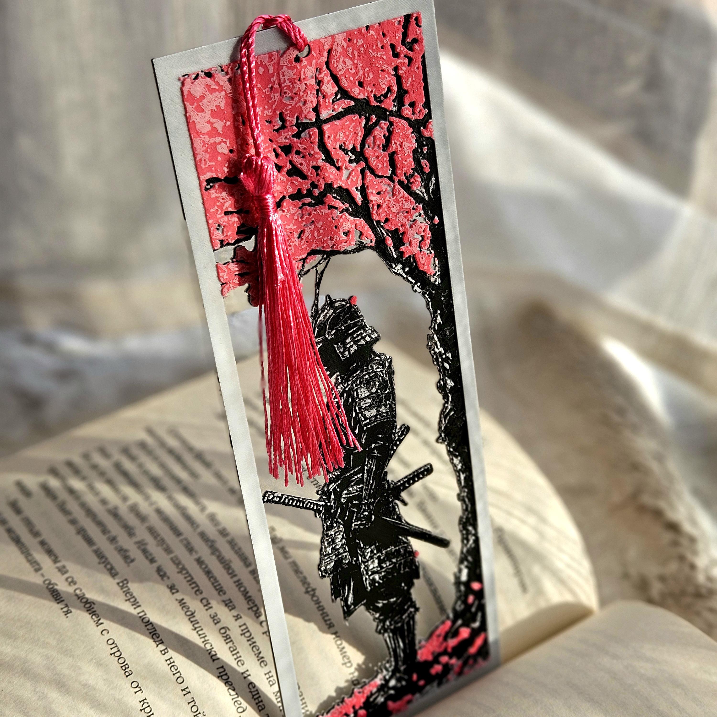 Bookmark with a samurai design on an open book