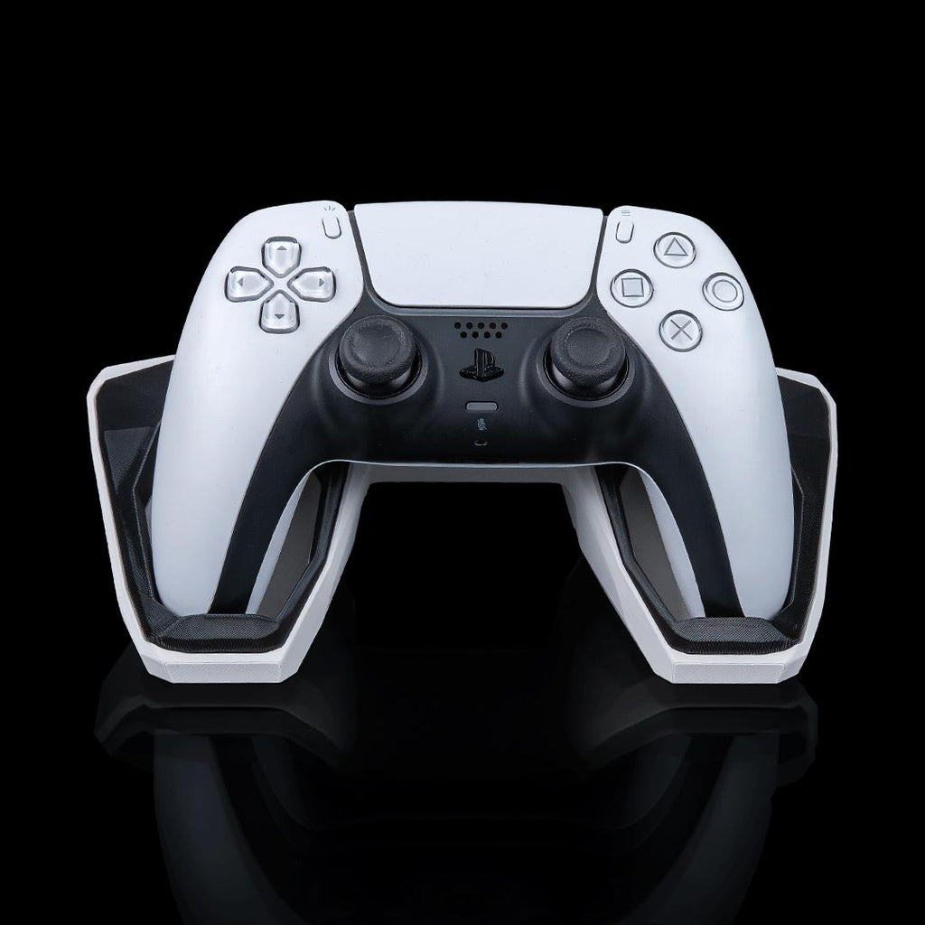 Geometric controller stand from the front, holding a white PS5 controller