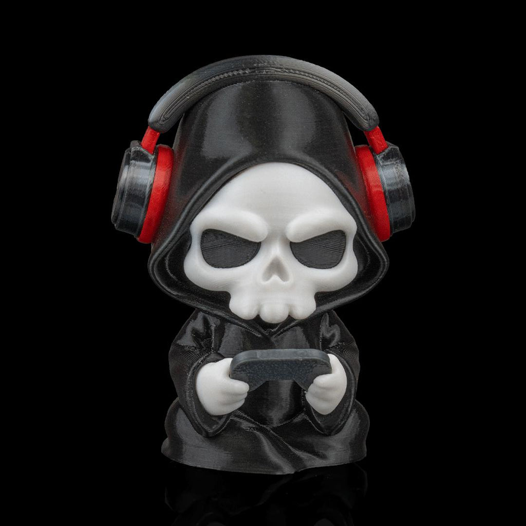 Gamer Grim Reaper figure from the front, holding a controller, wearing red and black headphones