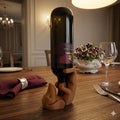 Brown dachshund wine bottle holder with a bottle of red wine on a dining table