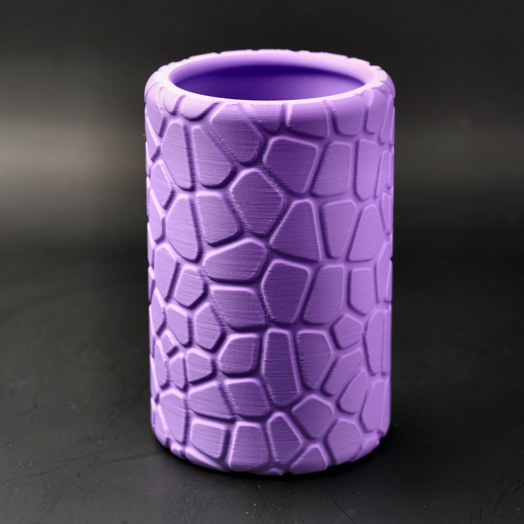 Purple geometric pencil pot with its raised cobblestone pattern