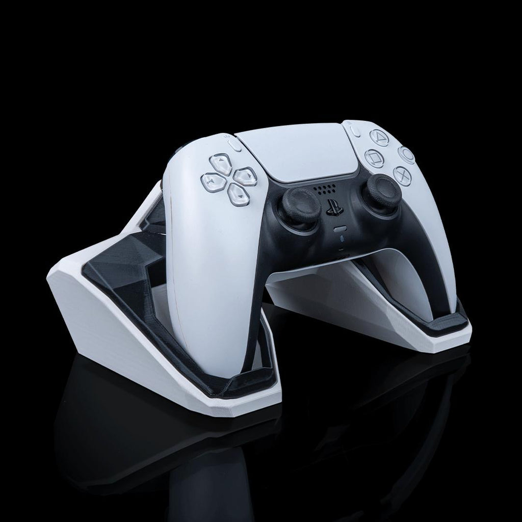 Geometric controller stand from an angle, holding a PS5 controller