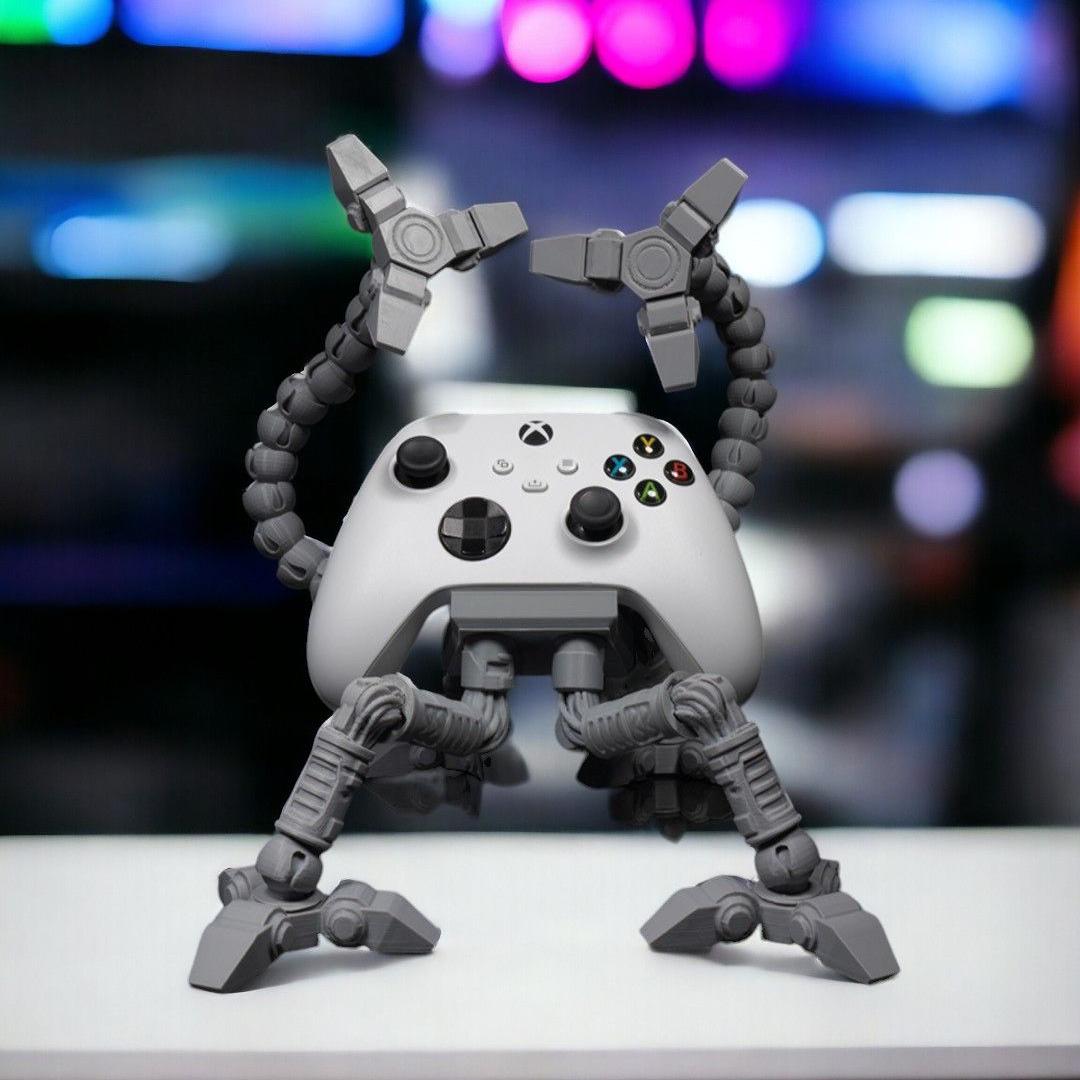 Mech controller stand with its jointed arms raised, holding a white Xbox controller