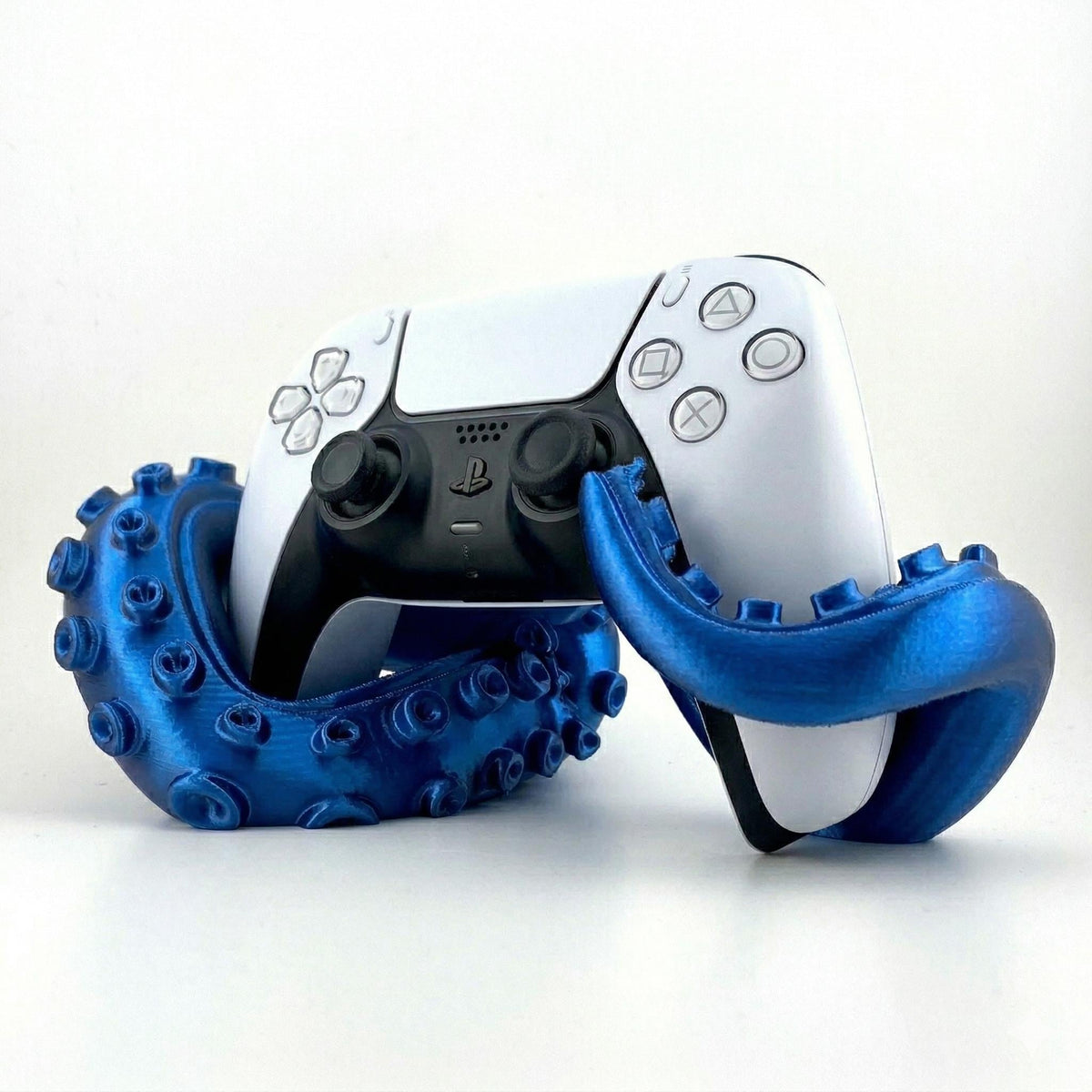 Deep blue kraken tentacle stand with a PS5 controller