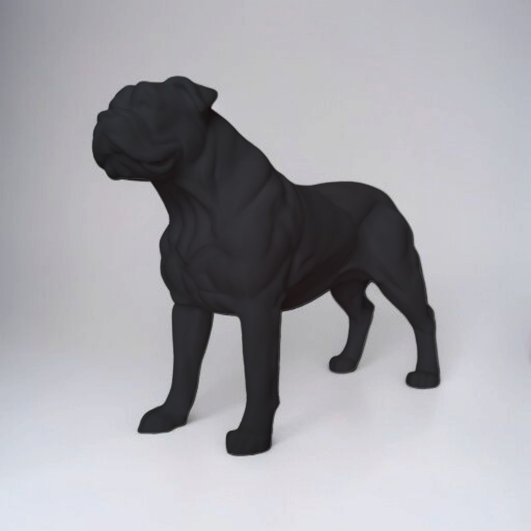 Black dog sculpture on a white background