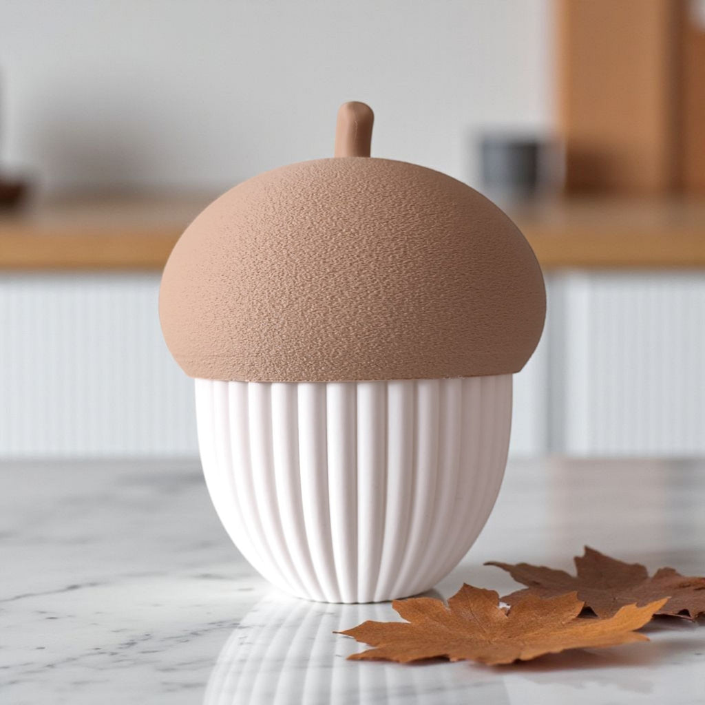 acorn-shaped container on a marble surface with a blurred kitchen background