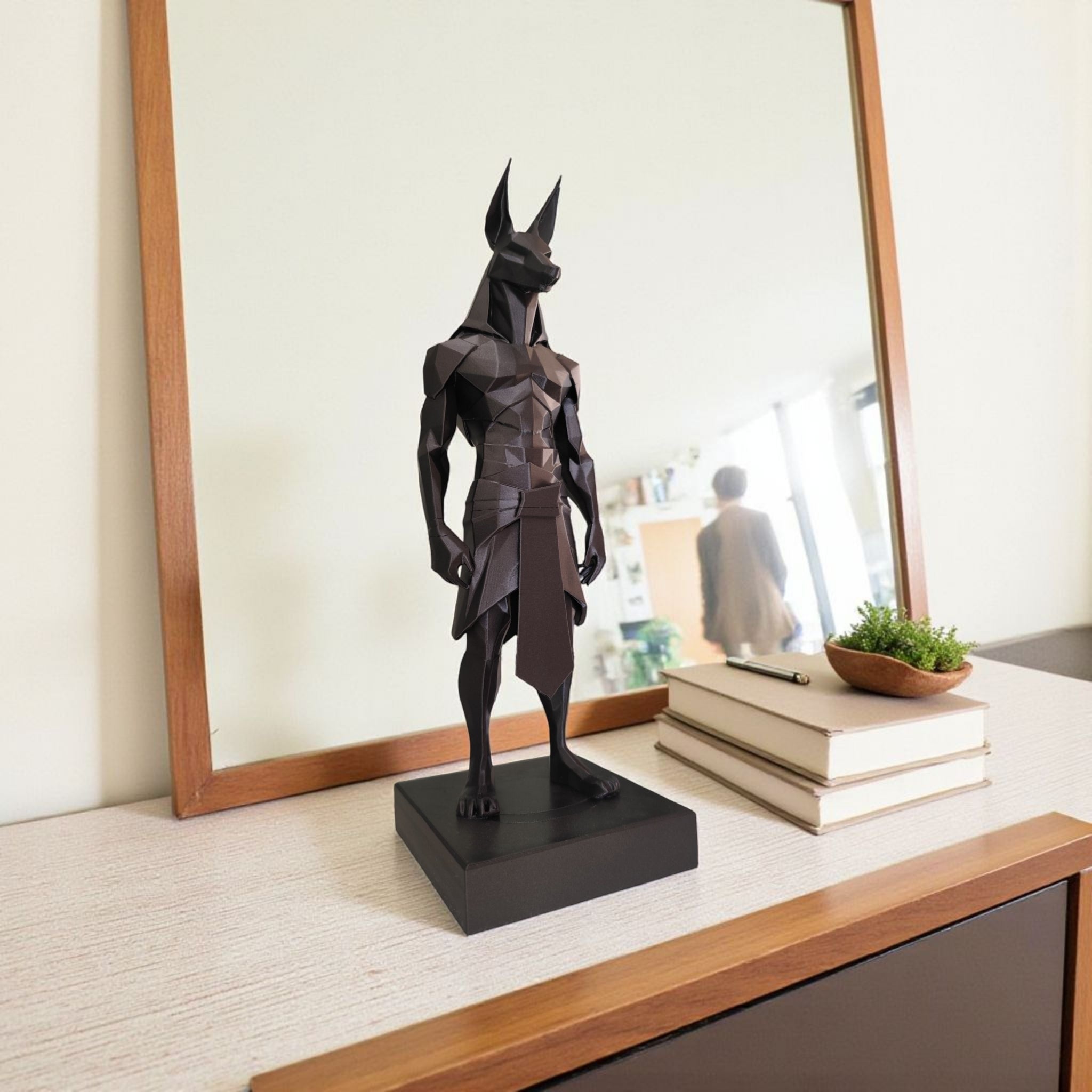 Modern minimalist Anubis statue paired with matching bust