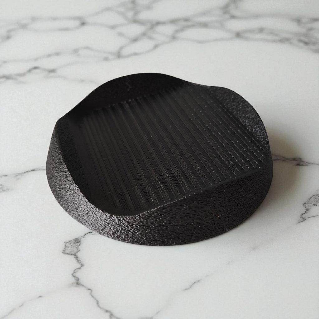 Black base on a marble surface