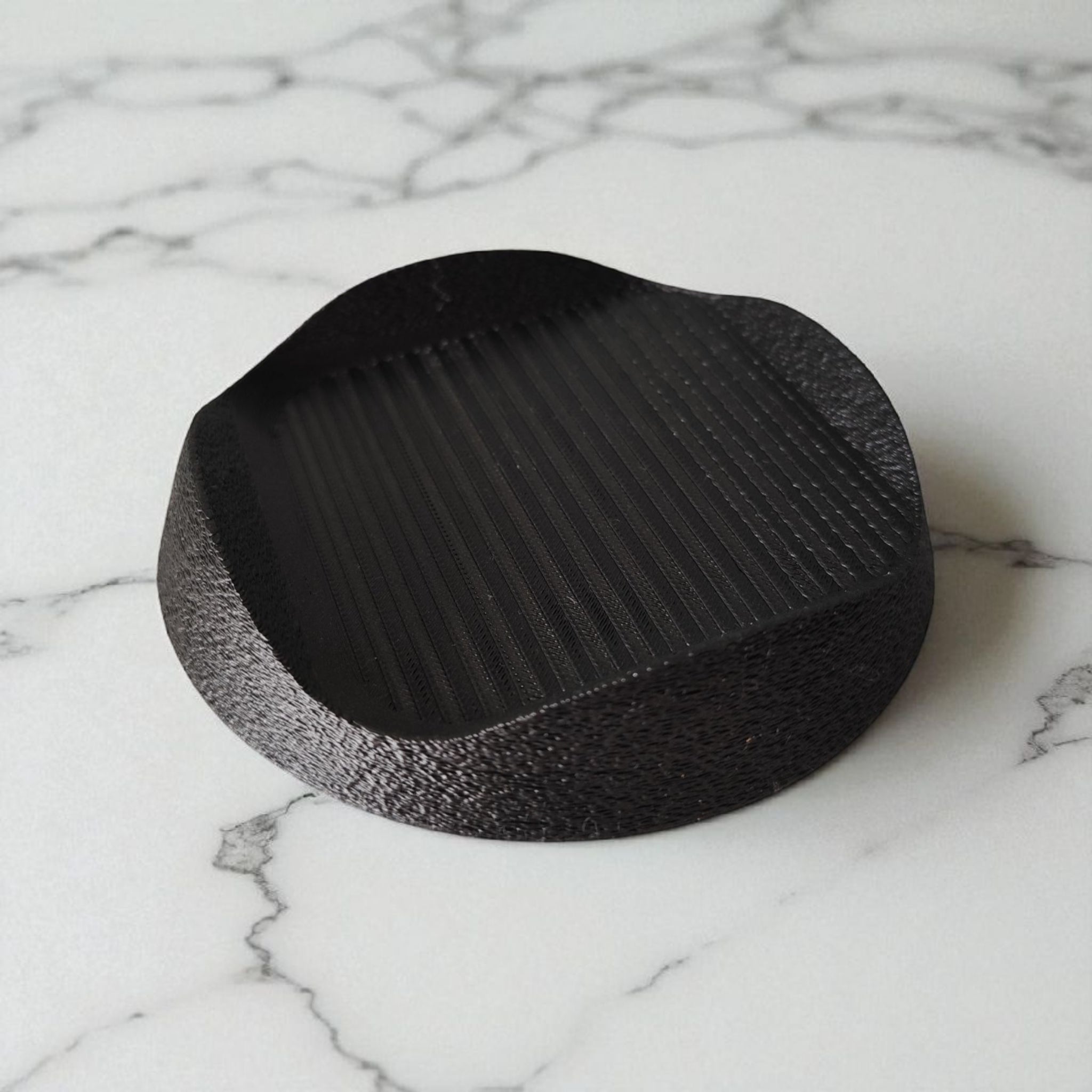 Black base on a marble surface