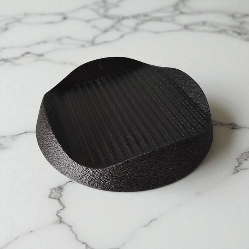 Black base on a marble surface