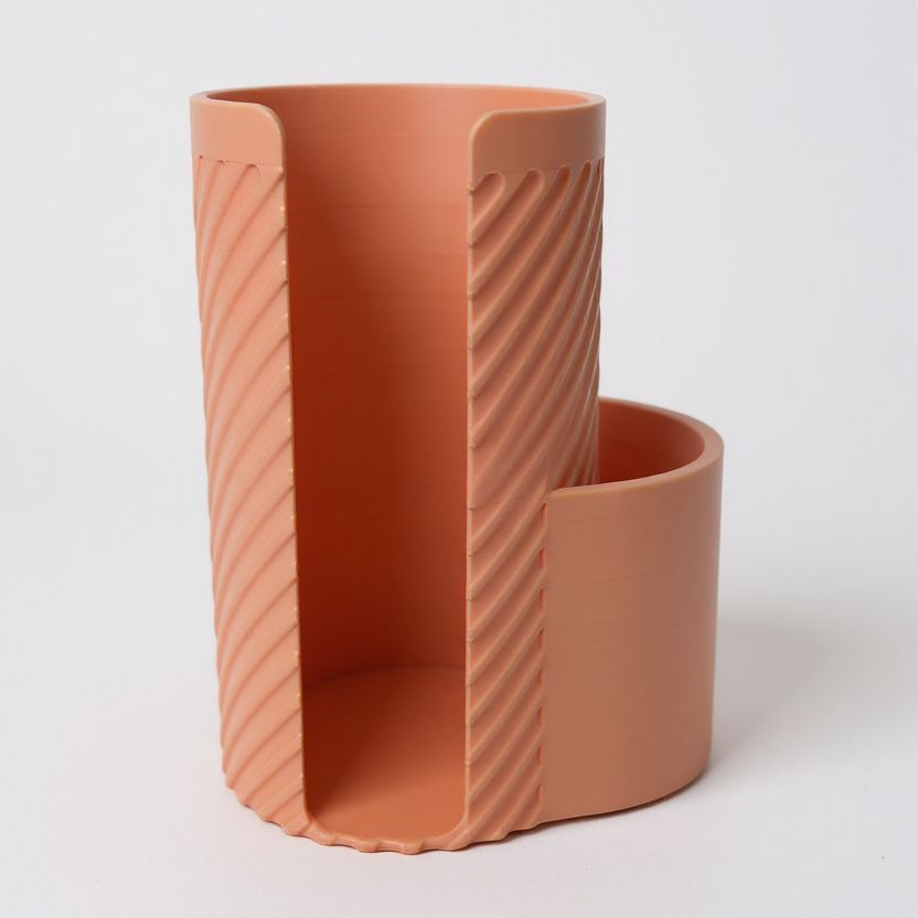 Side view of the MakeUpMate, highlighting its ribbed walls and durable construction.